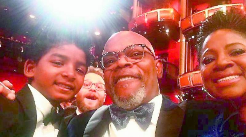 Sunny Pawar takes a selfie with actor Samuel L Jackson and his wife, while Seth Rogen photobombs the photo session. The Pulp Fiction star Jackson is clearly smitten by Pawar, who, he believes, should have won an Oscar on Monday as he is killing it.