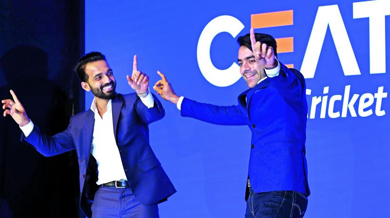 Ajinkya Rahane (left) and Rashid Khan during an awards function in Mumbai. (Photo: AP)