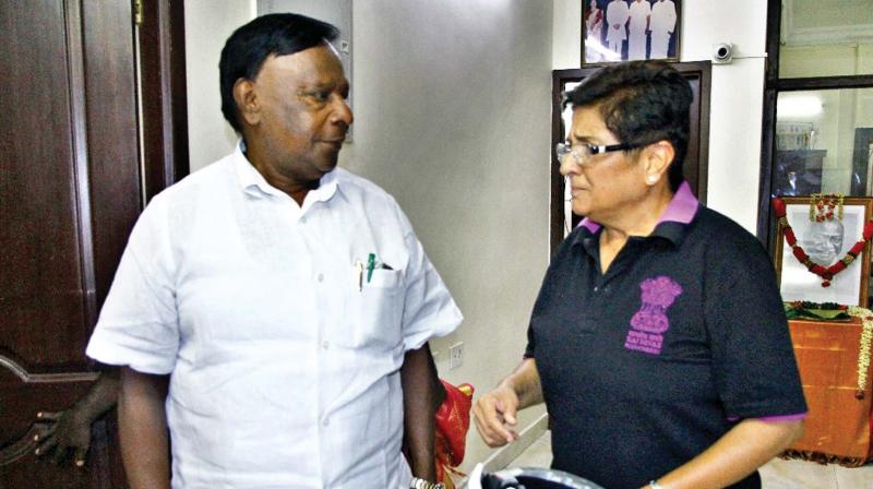 Lt Governor Kiran Bedi interacts with Chief Minister V. Narayanasamy  at his residence to greet CM on his birthday in Puducherry on Tuesday.