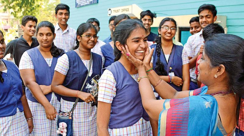 Students of Bhaktavatsalam Vidyashram, Korattur celebrate their class 10 CBSE results, which were announced on Tuesday. (Photo: DC)