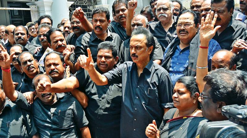 DMK members, all clad in black, led by their working president M. K. Stalin trouped out of the Assembly on Tuesday after staging a walkout demanding the  resignation of Chief Minister Edappadi K. Palaniswami. (Photo: DC)