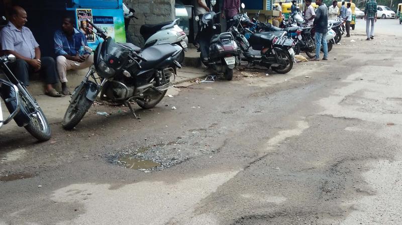 Despite numerous complaints, the roads in Ejipura continue to be full of potholes 	(Photo:DC)