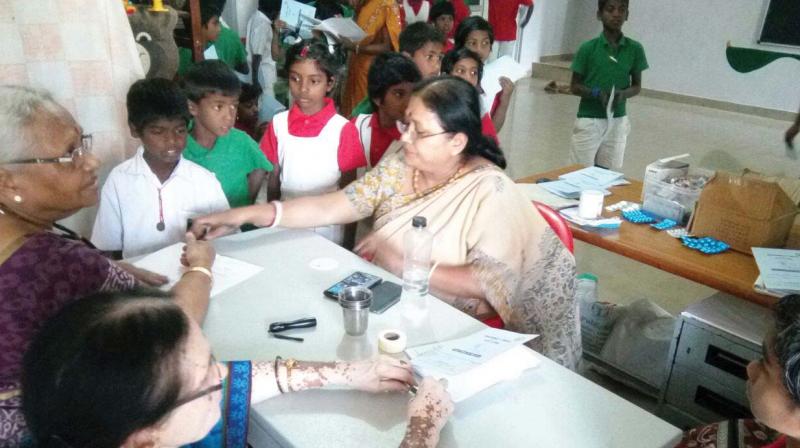 V. Annapoorna Ram and her team taking care of abandoned children.