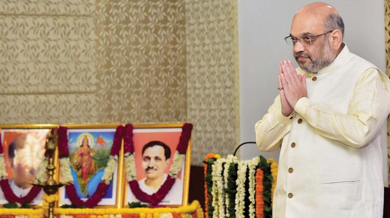 BJP national president Amit Shah arrives for a party office bearers meeting at NDMC Convention Centre, in New Delhi on Sunday 	(Photo: PTI)