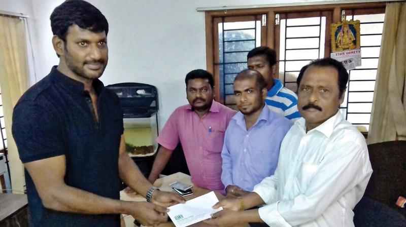 Vishal extending his support to a reporter.