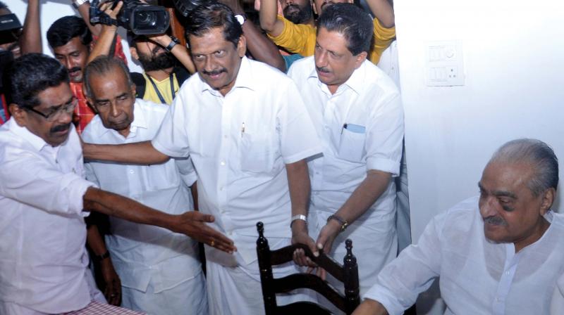 KPCC president Mullapally Ramachandran compels Kerala Congress (M) leader P.J. Joseph to sit near party chairman K.M. Mani in the presence of KC(M) leaders and MLAs C.F. Thomas and Mons Joseph in Kochi on Sunday. 	SUNOJ NINAN MATHEW)