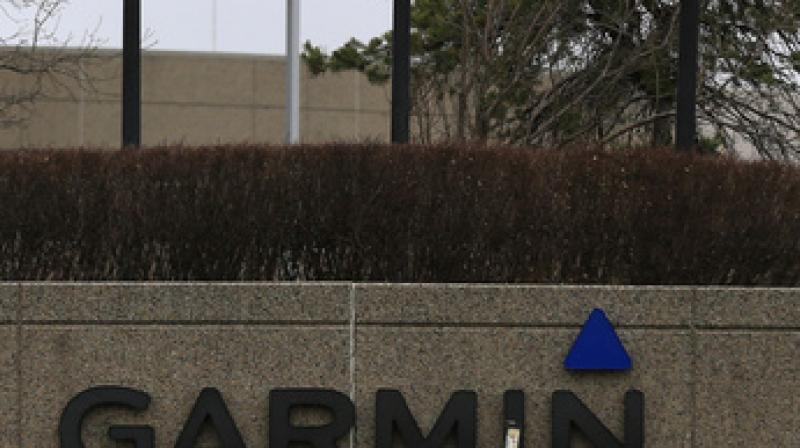 Flags are at half staff at Garmin headquarters Olathe in Kansas. (Photo: AP)