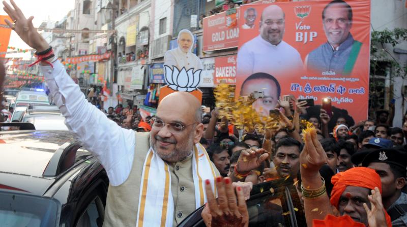 BJP president Amit Shah during a road show road show at Ramnagar on Wednesday.  (Deepak Deshpande)