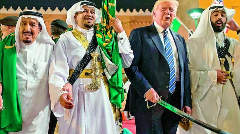 US President Donald Trump and his host and Saudi Arabia King Salman join the sword dance in Riyadh.