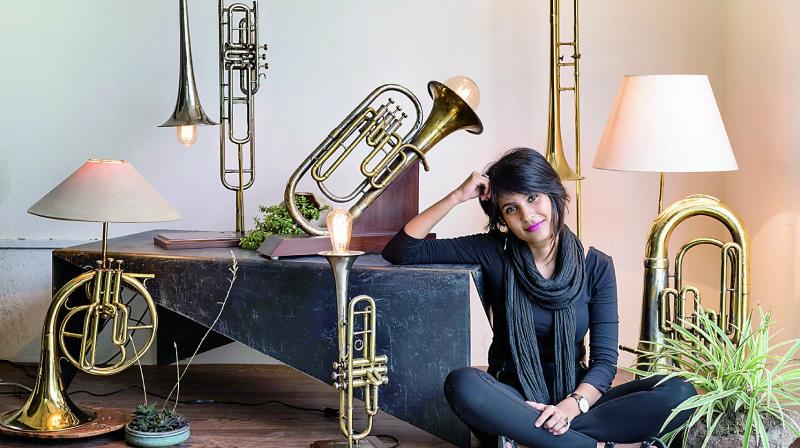 Advaeita Mathur poses with her Vintage Instrument Lamps Project collection.