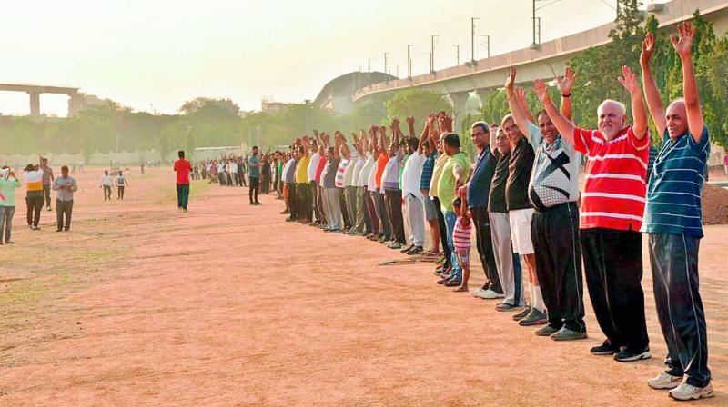 Protesters formed a human chain connecting the two ends of the Parade Ground on Saturday morning. (Photo: DC)