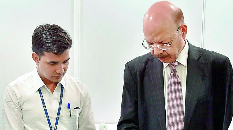 Chief Election commissioner Nasim Zaidi demonstrates the working of EVMs and Voter Verifiable Paper Audits Trail System in New Delhi on Saturday. (Photo: PTI)