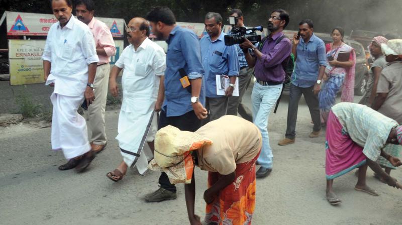 PWD minister G. Sudhakaran and P.T. Thomas MLA inspect the road repairing works at Civil Line Road in Kochi on Friday. 	DC
