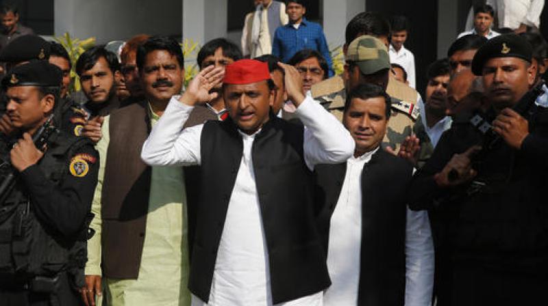Chief Minister of Uttar Pradesh state Akhilesh Yadav comes out of a polling station after casting his vote in Saifai. (Photo: PTI)
