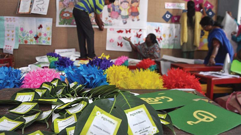 Teachers and SSA officials busy decorating the classrooms on the eve of school re opening at Government Girls LP School in Kochi on Wednesday. (Photo: SUNOJ NINAN MATHEW)