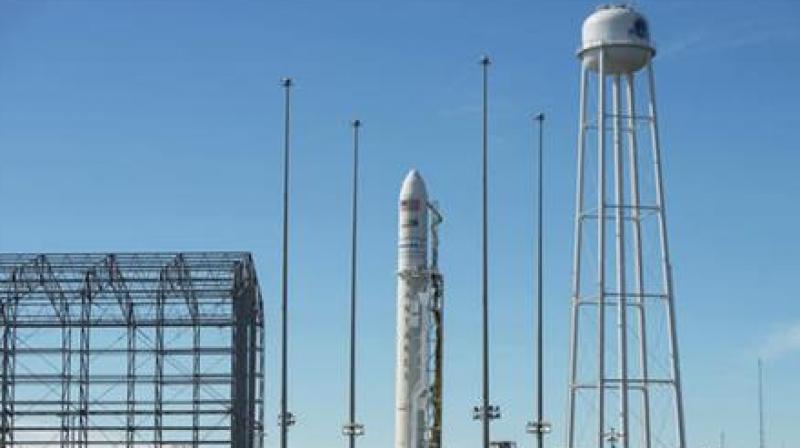 In this Friday, Oct. 14, 2016 photo, an Orbital ATK Antares rocket carrying the Cygnus spacecraft is raised into the vertical position on launch Pad-0A at NASAs Wallops Flight Facility in Virginia. The Sunday, Oct. 16, 2016 scheduled cargo resupply mission to the International Space Station would be the companys first Antares launch since an explosion seconds after liftoff in 2014, which destroyed the rocket and space station supply ship, and damaged the launch complex. (Bill Ingalls/NASA via AP)