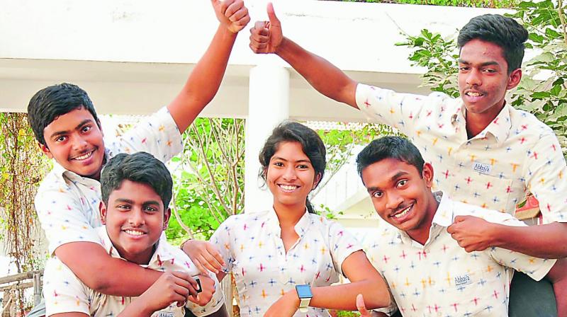 (Left to right) Mustafa, Sudaamsh, Geethika, Shane and Milind display the V-watch