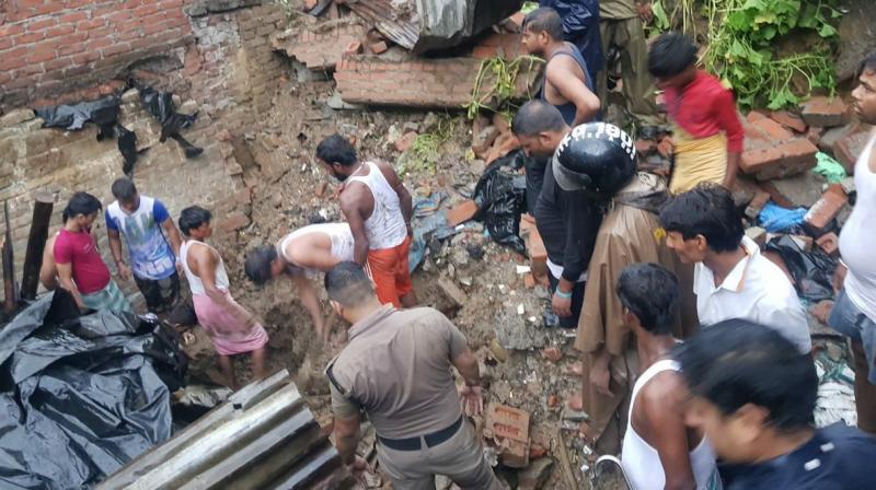 Four persons, including a woman and a minor boy, were killed when debris from a hillside fell on a residential building near Shastri Nagar in Dehradun district.