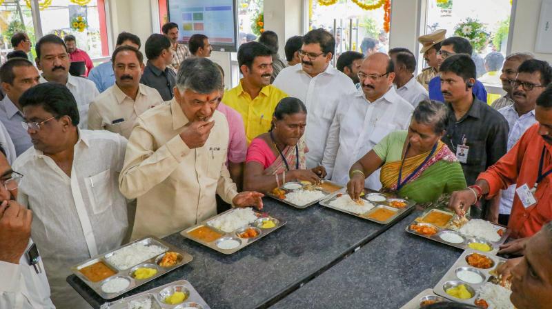 Andhra Pradesh Chief Minister N Chandrababu Naidu has lunch during the launch of Phase I of Anna Canteens on Wednesday. (Photo: PTI)