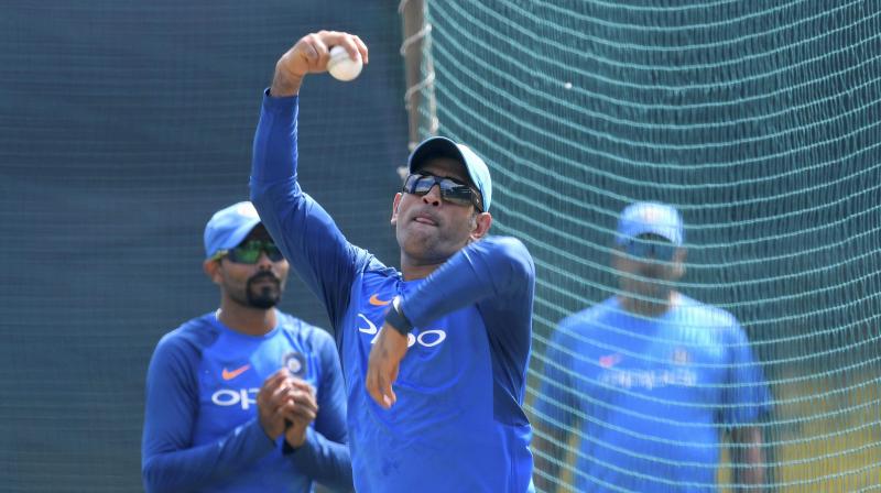 MS Dhoni, who is playing a key role in grooming the Virat Kohli-led young Indian side, bowled alongside the three other spinners in the squad  Kuldeep Yadav, Axar Patel and Ravindra Jadeja. (Photo: PTI)