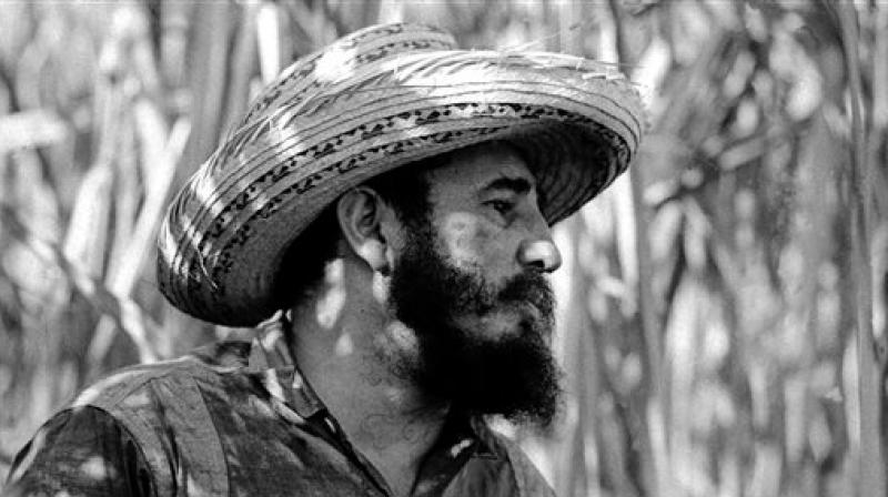 In this April 14, 1966 file photo, Cubas leader Fidel Castro stands on a sugar cane plantation in Cuba. (Photo: AP)