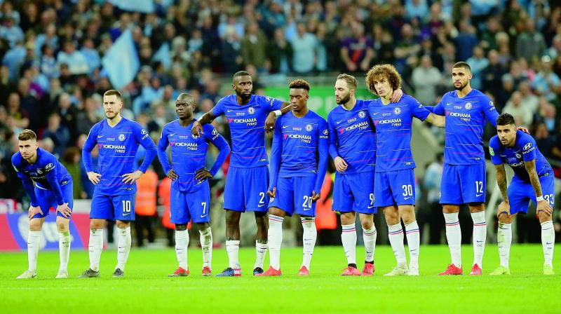 Chelsea players during the penalty shootout in their League Cup final against Manchester City at Wembley on Sunday. (Image: AP)