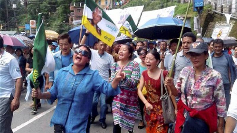 GJM supporters holding a rally for separate Gorkhaland in Darjeeling on Monday. (Photo: PTI)