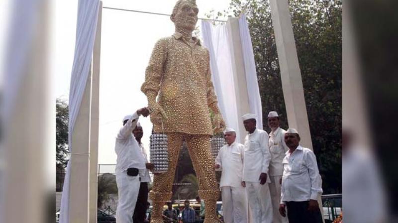 The installation is a tribute to Dabbawalas, the network of lunch-delivery men who ferry lunch boxes from homes to offices and back with precision and efficiency. (Photo: PTI)