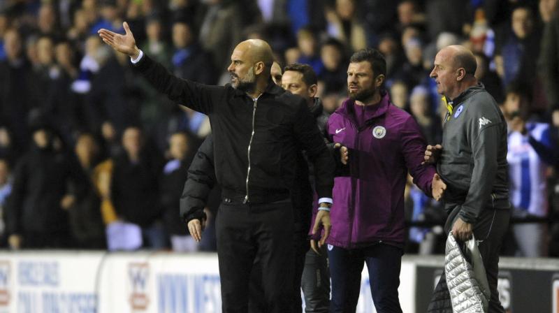 Pep Guardiolas quest to win an unprecedented quadruple with Manchester City came to a stunning and controversial end when they fell to a 1-0 defeat at third-tier Wigan in the fifth round of the FA Cup. (Photo: AP)