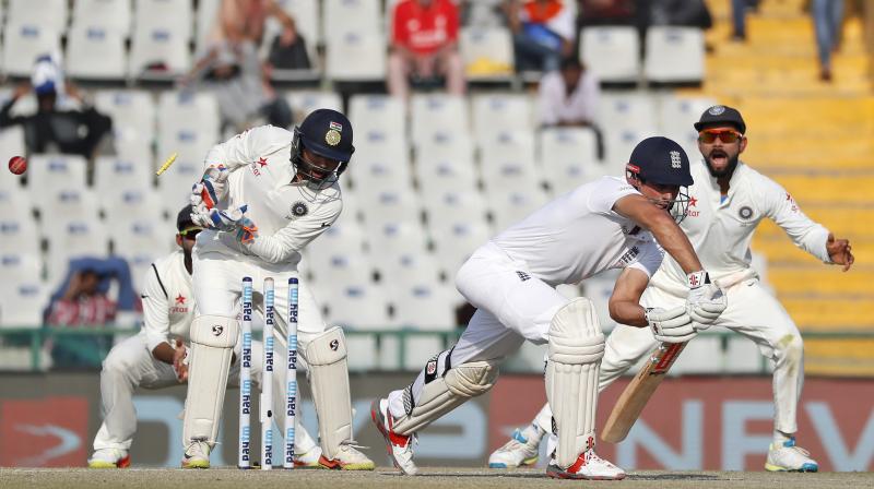This peach of a delivery by R Ashwin (not in picture) decieved one and all, including england skipper Alastair Cook (centre) and Parthiv Patel (right). (Photo: BCCI)