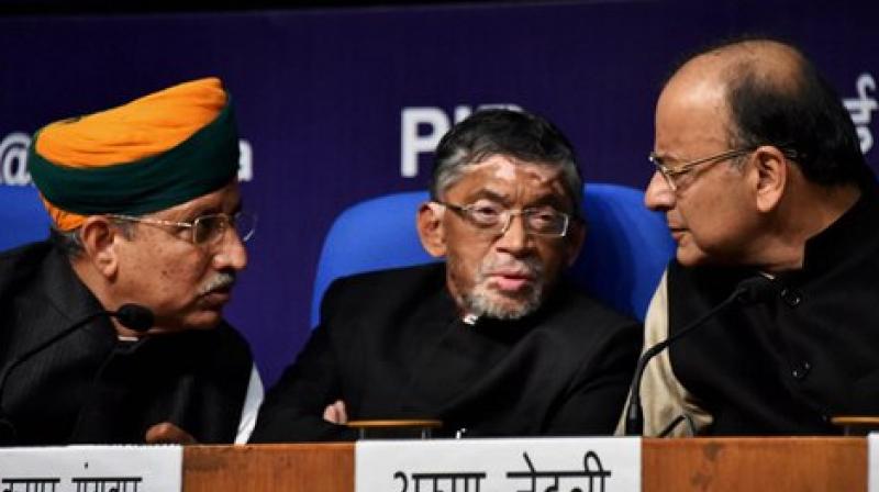 nion Finance Minister Arun Jaitley alongwith MoS for Finance and Corporate Affairs, Arjun Ram Meghwal and Santosh Kumar Gangwar during a Post-Budget press conference in New Delhi on Wendnesday. (Photo: PTI)
