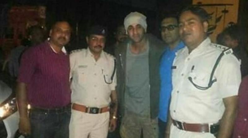 Ranbir can be seen posing for pictures with police officials in Bhopal(Pic courtesy: Instagram/ ranbirkapooruniverse).