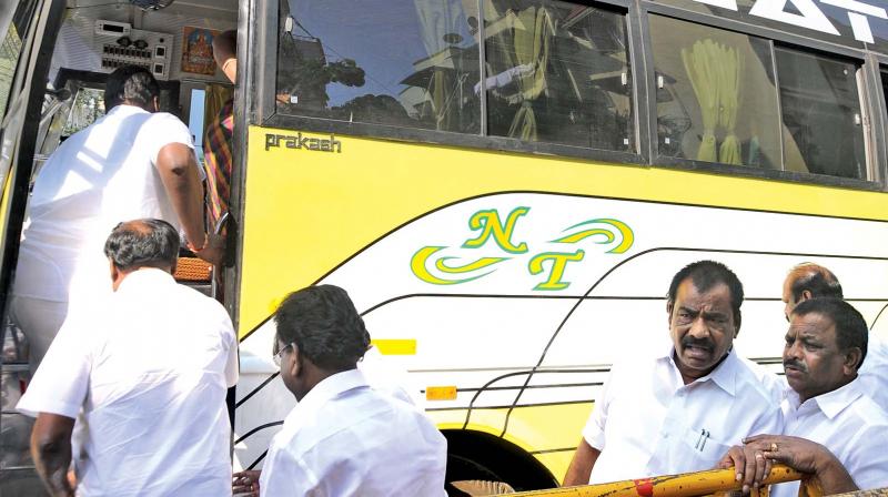 AIADMK MLAs being taken in a bus by the party office bearers after being addressed by party general secretary V.K. Sasikala on Wednesday (Photo: DC)