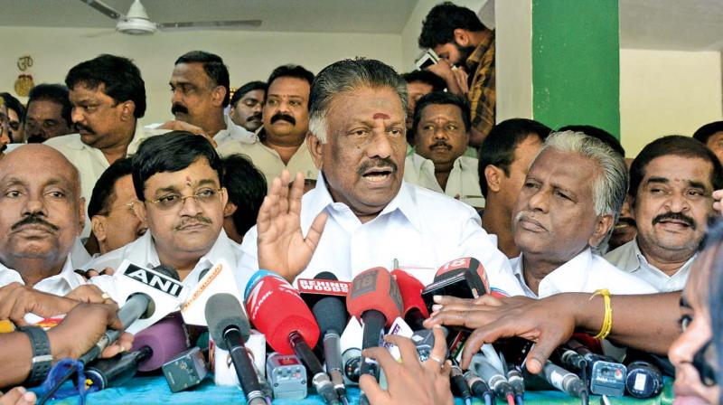 Caretaker chief minister O Panneerselvam addresses the media along with his  supporters at his residence on Wednesday (Photo: DC)