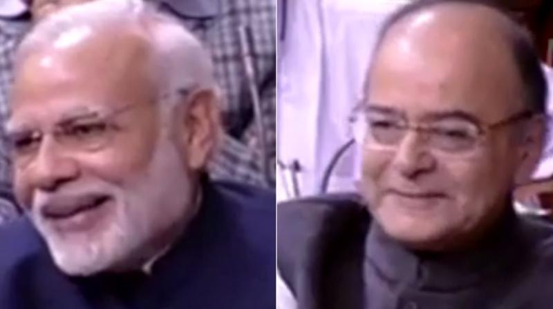 Prime MInister Narendra Modi and Finance Minister Arun Jaitley share a laugh during debate in Rajya Sabha (Photo: Videograb)