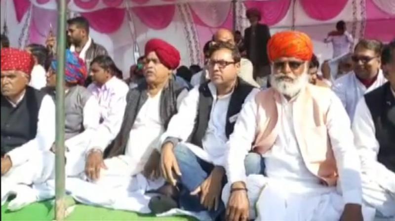 The protestors are demanding five per cent separate reservation to Gujjars, Raika-Rebari, Gadia Luhar, Banjara and Gadaria for government jobs and admission in educational institutions. (Photo: ANI | Twitter)