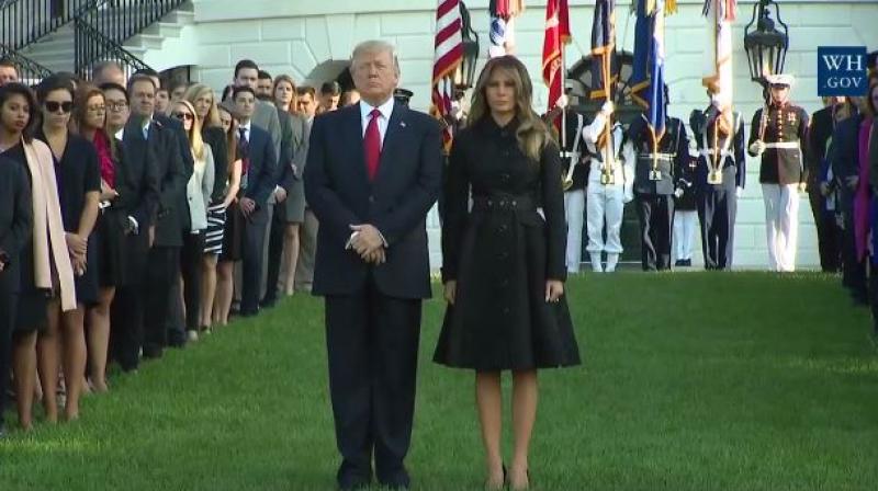 The president, and his wife, Melania, placed their hands on their hearts and bowed their heads as a bell tolled and a Marine played the mournful Taps on a trumpet. (Photo: Facebook)