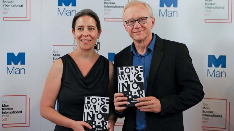 US translator Jessica Cohen and Israeli author David Grossman pose for a photograph with his book A Horse Walks Into a Bar at the shortlist photocall for the Man Booker International Prize, at St. James Church in London. (Photo: AFP)