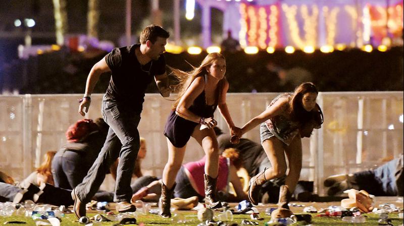 File photo of people fleeing from the open air Route 91 Harvest country music festival, Las Vegas, after a gunman opened indiscriminate fire at the audience. (Photo: AFP)