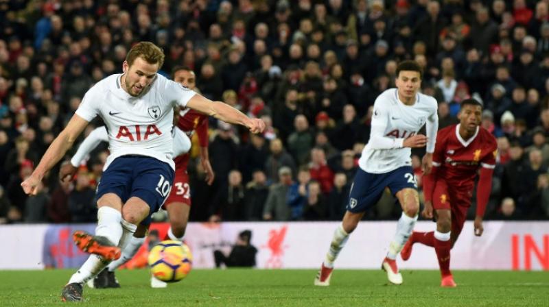 Harry Kane scored his 100th Premier League goal from the penalty spot in stoppage time to snatch a point for Tottenham Hotspur against Liverpool. (Photo: AFP)