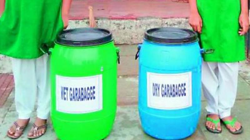 Nellore Municipal Corporation has installed green and blue containers in 12 wards of the corporation.