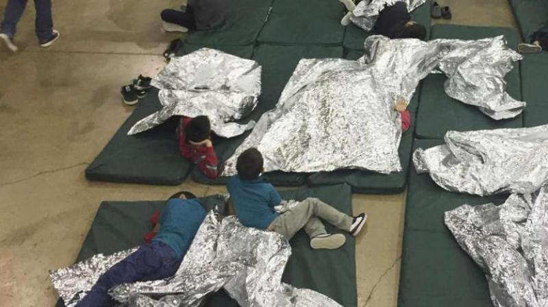 Photo of people taken into custody related to cases of illegal entry into the United States resting in one of the cages at a facility in McAllen, Texas. (Photo: AP)