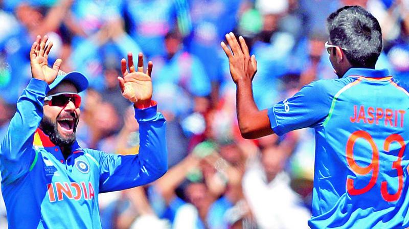 Virat Kohli celebrates with Jasprit Bumrah. (Photo: AP)