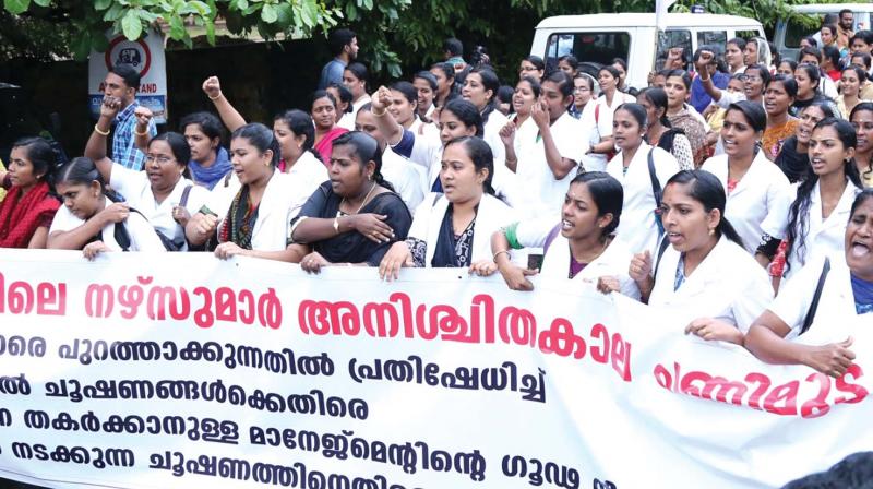 United Nurses Association (UNA) takes out a protest march to Aswini Hospital in Thrissur on Tuesday. 	(Photo: DC)