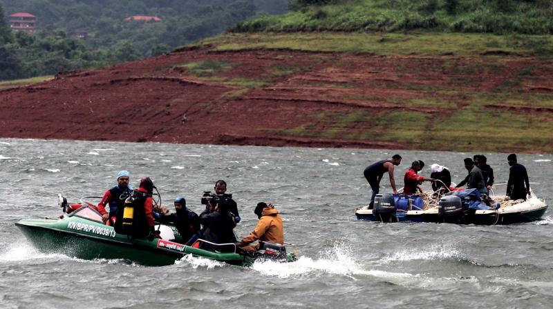 The Navy team on search for the missing at Banasura Reservoir at Wayanad on Tuesday.