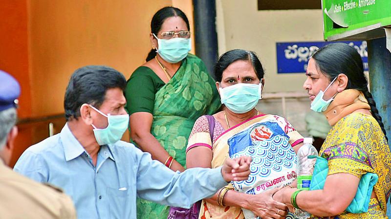People wear surgical masks as a protective measure against swine flu, at the Gandhi Hospital in Secunderabad on Thursday. (Photo: DC)