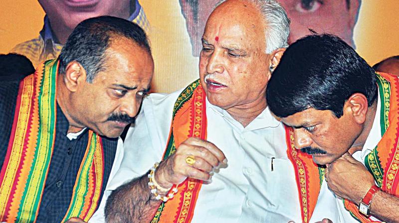 State BJP president B.S. Yeddyurappa with party MP P.C. Mohan (left) at a campaign for Council election in Chikkaballapura on Thursday. (Photo: KPN)