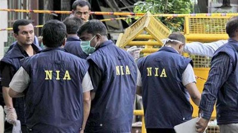 National Investigation Agency officials
