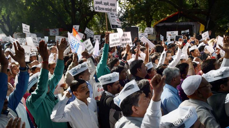 AAP workers shout slogans during a protest march against demonetization of Rs 500 and Rs 1000 notes, in New Delhi. (Photo: PTI)