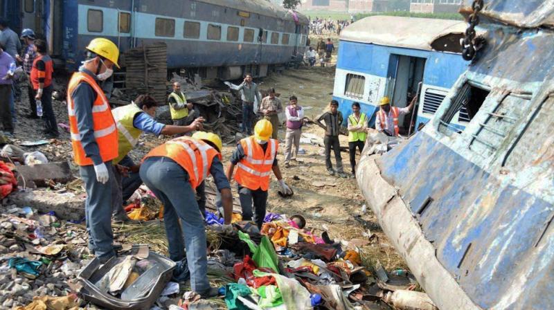 Rescuers and relief works in progress at the site of accident where Patna-Indore Express train derailed near Pukhrayan village in Kanpur Dehat district. (Photo: PTI)